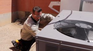 man working on air conditioner repair image